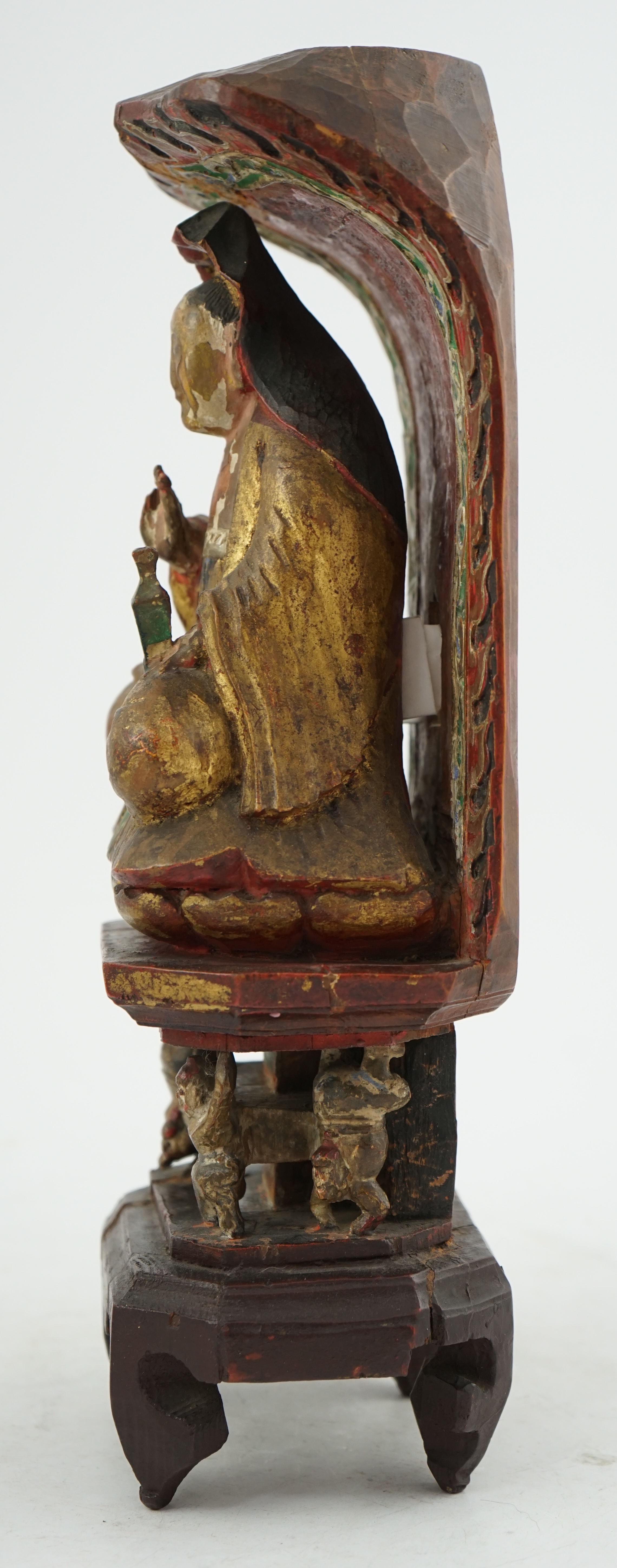 A Chinese polychrome and giltwood seated figure of Guanyin, Guangxu period inscription for the first year of his reign, c.1875